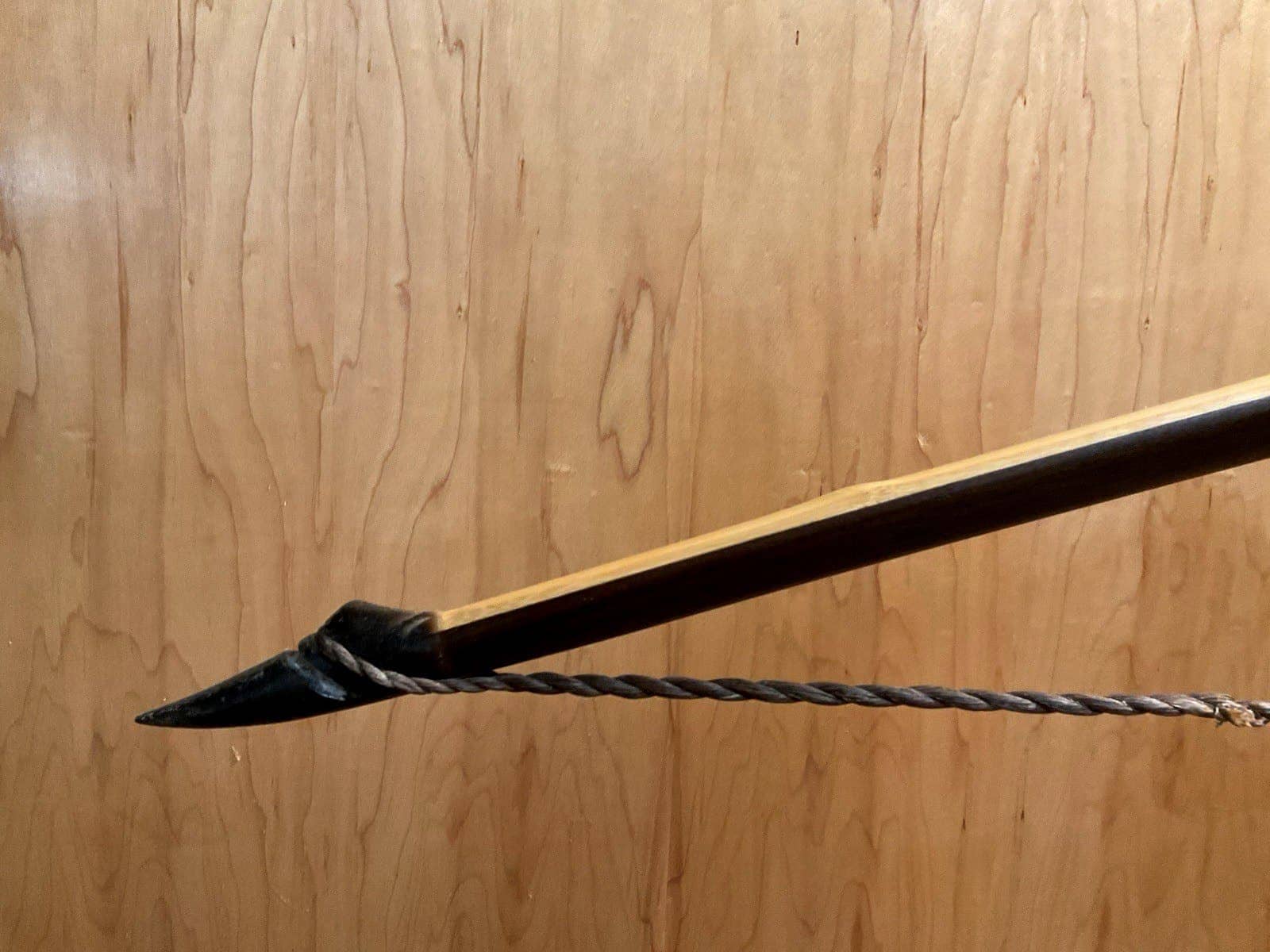 The left buffalo horn tip of the 115-pound bamboo-backed ipe warbow, with its twisted string