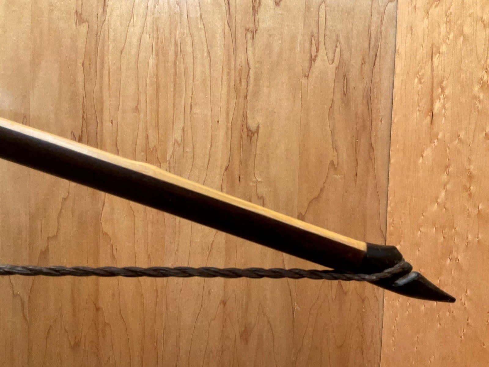 The right buffalo horn tip of the 115-pound bamboo-backed ipe warbow, with its twisted string