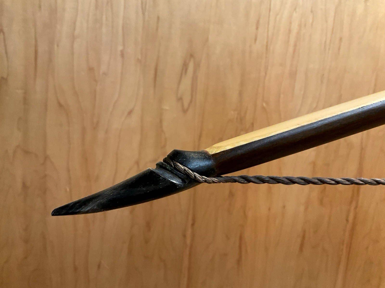 The left buffalo horn tip of the 150-pound bamboo-backed ipe warbow, with its twisted string