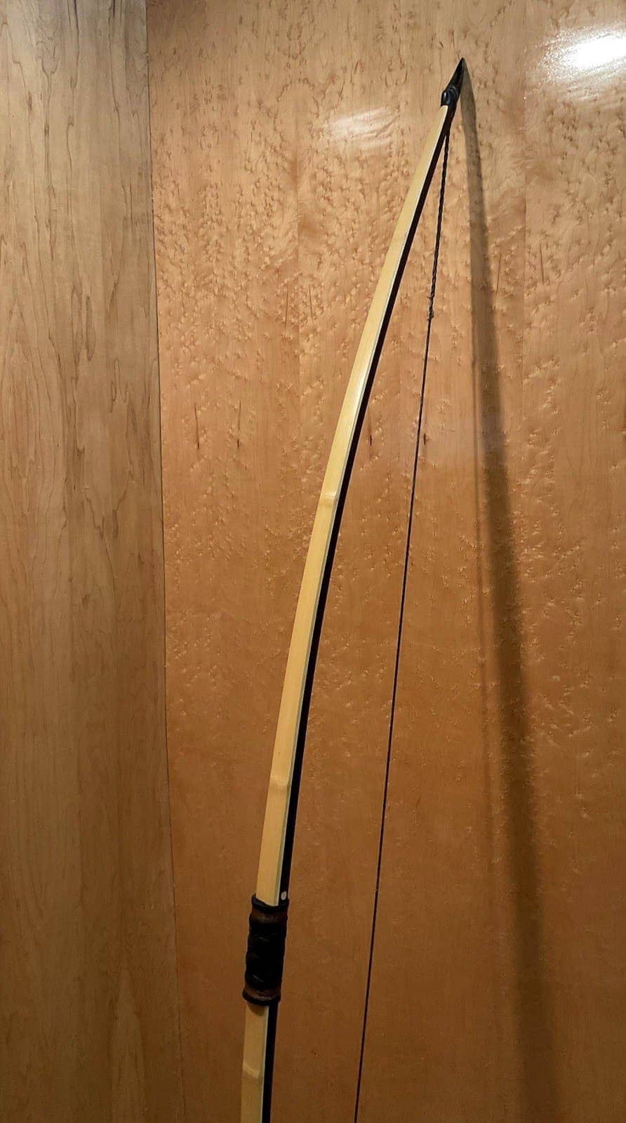 The 150-pound bamboo-backed ipe warbow, standing, the bamboo back and dark ipe belly in view