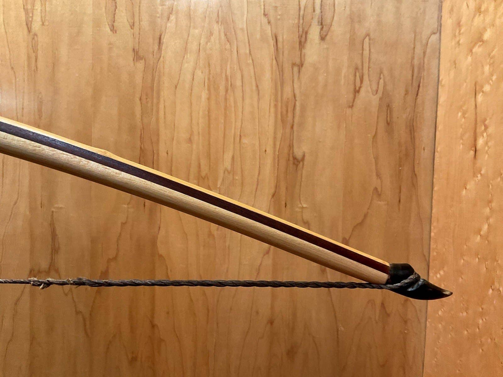 The right buffalo horn tip of the 180-pound bamboo-backed tri-lam warbow, with its twisted string
