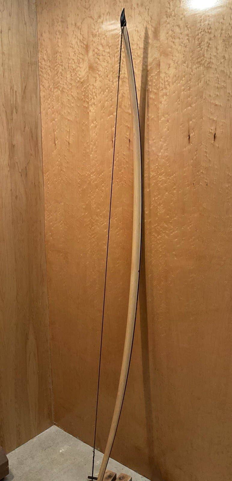 The 180-pound bamboo-backed tri-lam warbow, standing, seen from the side