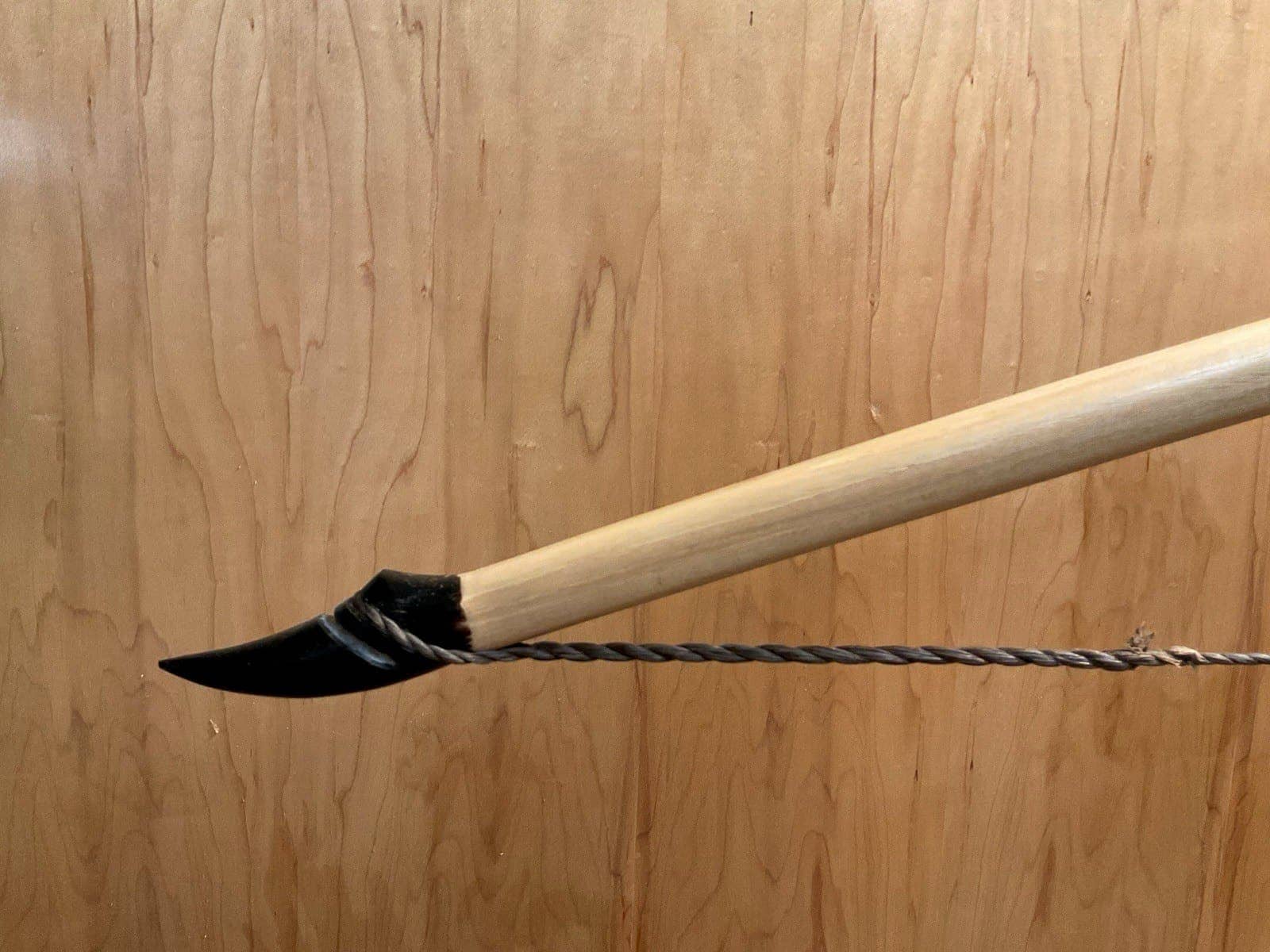 The left buffalo horn tip of the 190-pound white hickory selfbow warbow, with its twisted string