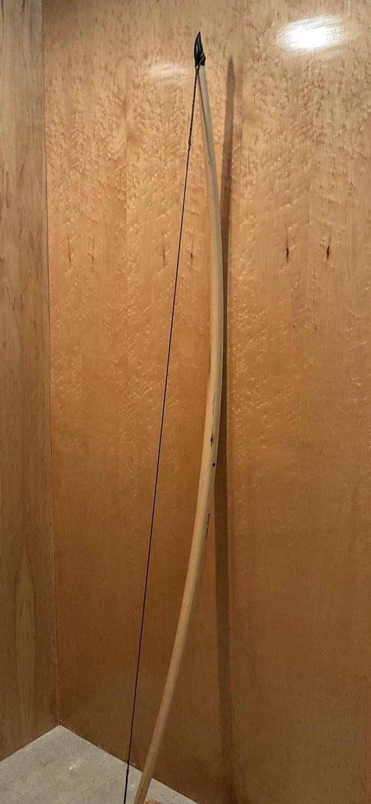 The 190-pound white hickory selfbow warbow, standing, seen from the side